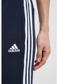 Adidas - adidas spodnie dresowe bawełniane kolor granatowy wzorzyste. Kolor: niebieski. Materiał: bawełna, dresówka #2