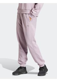 Adidas - adidas Spodnie dresowe ALL SZN IW1283 Fioletowy Loose Fit. Kolor: fioletowy. Materiał: bawełna