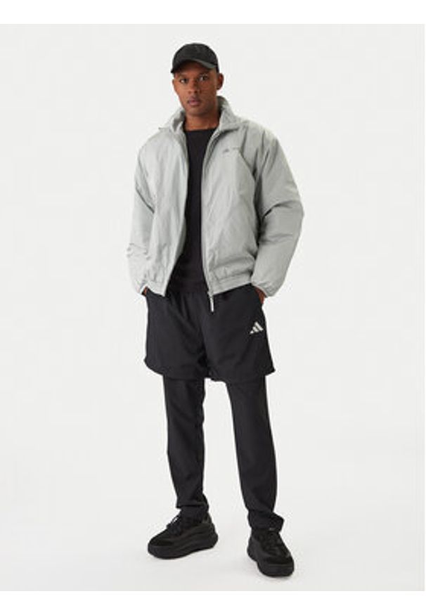 Adidas - adidas Kurtka przejściowa Moon Boot JM8923 Szary Loose Fit. Kolor: szary. Materiał: syntetyk