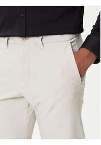 BOSS Spodnie materiałowe T_Commuter 50534303 Beżowy Slim Fit. Kolor: beżowy. Materiał: syntetyk