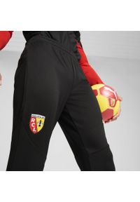 Spodnie piłkarskie Puma RC Lens 24/25 treningowe. Materiał: materiał. Wzór: aplikacja. Sport: piłka nożna