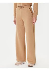 Guess Spodnie dresowe V5YB19 KBSL2 Beżowy Regular Fit. Kolor: beżowy. Materiał: syntetyk