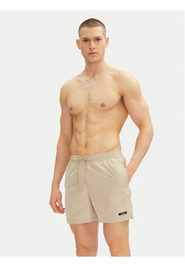 Calvin Klein Swimwear Szorty kąpielowe KM0KM01111 Beżowy Regular Fit. Kolor: beżowy. Materiał: syntetyk