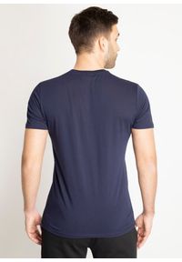 Koszulka męska Lacoste T-Shirt (TH6709-166). Typ kołnierza: polo. Kolor: niebieski. Materiał: dzianina. Długość: krótkie. Sezon: lato. Sport: bieganie