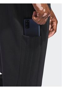 Adidas - adidas Spodnie dresowe Essentials HZ2218 Czarny Regular Fit. Kolor: czarny. Materiał: bawełna #6
