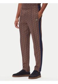 Lacoste Spodnie dresowe XH1440 Brązowy Regular Fit. Kolor: brązowy. Materiał: syntetyk