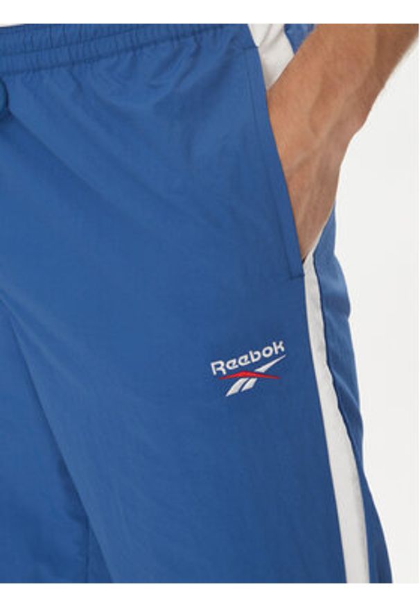 Reebok Spodnie dresowe 100215278 Niebieski Regular Fit. Kolor: niebieski. Materiał: syntetyk