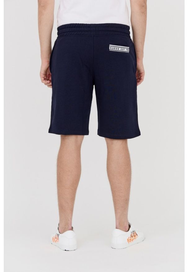 Guess - GUESS Granatowe dresowe szorty męskie, Rozmiar L. Kolor: niebieski. Materiał: bawełna, dresówka