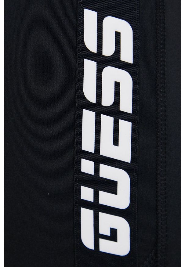 Guess - Legginsy. Kolor: czarny. Materiał: skóra, dzianina. Wzór: nadruk