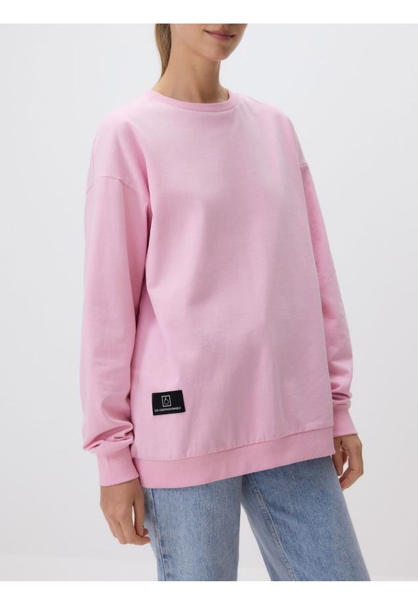 Reserved - Bawełniana bluza z aplikacją - pastelowy róż. Kolor: różowy. Materiał: bawełna. Wzór: aplikacja