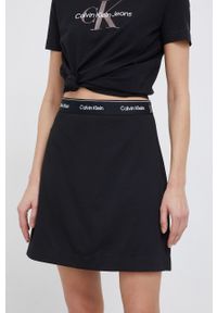 Calvin Klein Spódnica kolor czarny mini rozkloszowana. Stan: podwyższony. Kolor: czarny. Materiał: włókno, dzianina. Wzór: gładki
