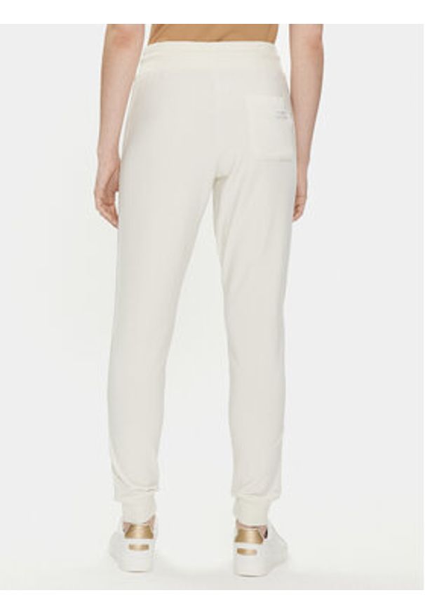 TOMMY HILFIGER - Tommy Hilfiger Spodnie dresowe UW0UW04785 Écru Regular Fit. Materiał: dresówka