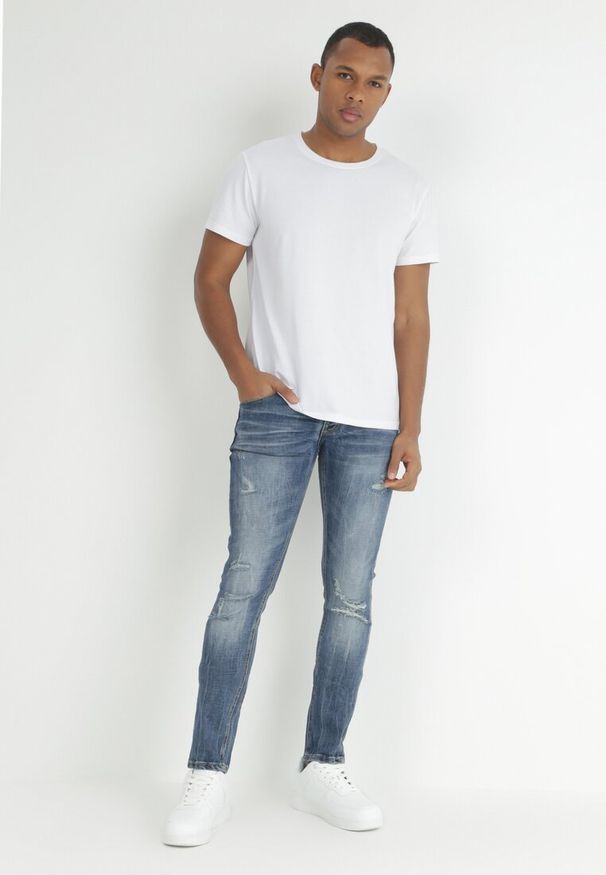 Born2be - Niebieskie Jeansy Skinny z Przetarciami i Dziurami Leonia. Kolor: niebieski