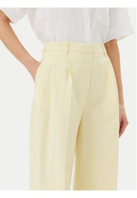 TOMMY HILFIGER - Tommy Hilfiger Spodnie materiałowe WW0WW45460 Żółty Relaxed Fit. Kolor: żółty. Materiał: len #3