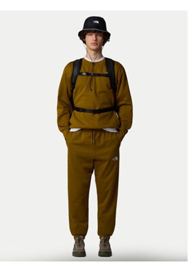 The North Face Spodnie dresowe Essential NF0A8A6J Zielony Relaxed Fit. Kolor: zielony. Materiał: bawełna
