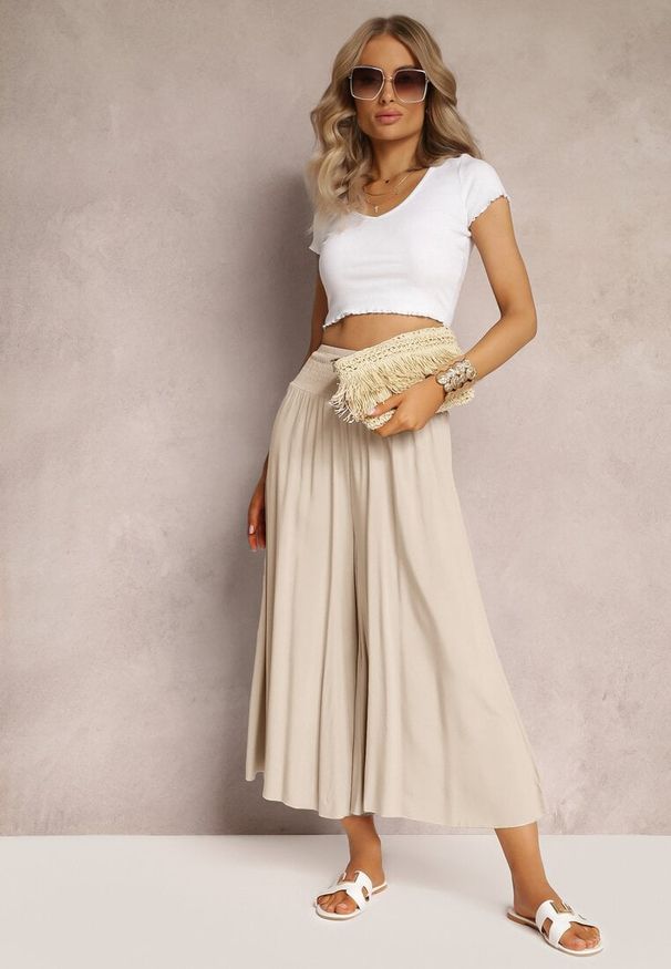 Renee - Jasnobeżowe Szerokie Spodnie High Waist o Długości 7/8 Rathi. Stan: podwyższony. Kolor: beżowy. Materiał: wiskoza, tkanina