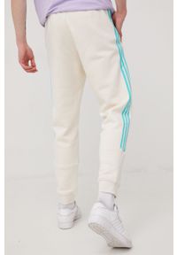 adidas Originals spodnie dresowe męskie kolor beżowy z aplikacją. Kolor: beżowy. Materiał: dresówka. Wzór: aplikacja #3