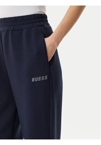 Guess Spodnie dresowe V4BB13 K7UW2 Granatowy Regular Fit. Kolor: niebieski. Materiał: wiskoza