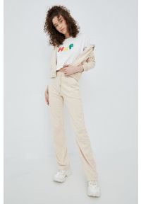 Juicy Couture spodnie dresowe damskie kolor beżowy gładkie. Stan: podwyższony. Kolor: beżowy. Materiał: dresówka. Wzór: gładki