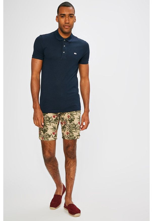 Lacoste - Polo. Typ kołnierza: polo. Kolor: niebieski. Materiał: dzianina. Długość: krótkie