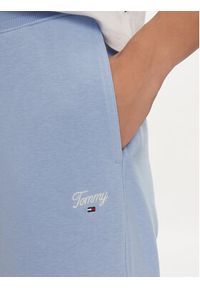 Tommy Jeans Spodnie dresowe Script DW0DW17771 Błękitny Relaxed Fit. Kolor: niebieski. Materiał: bawełna, syntetyk