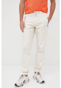 Sisley spodnie bawełniane męskie kolor beżowy joggery. Kolor: beżowy. Materiał: bawełna