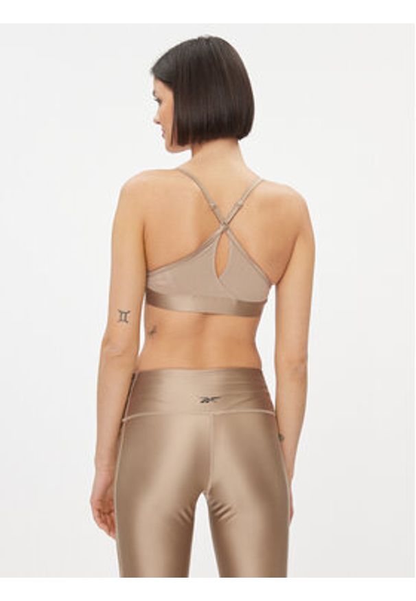 Reebok Biustonosz sportowy Holiday Lux IL4589 Beżowy. Kolor: beżowy. Materiał: syntetyk