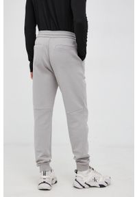 Calvin Klein - Spodnie. Kolor: szary. Materiał: dzianina