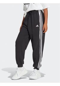 Adidas - adidas Spodnie dresowe Essentials 3-Stripes French Terry Loose-Fit Joggers HA4375 Czarny Loose Fit. Kolor: czarny. Materiał: bawełna