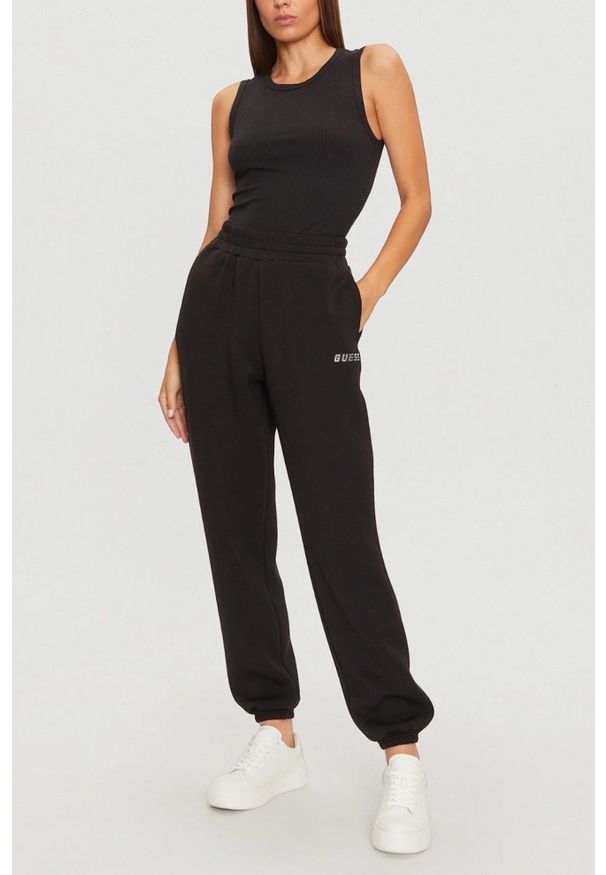 Guess - GUESS Czarne damskie spodnie dresowe Cecilia, Rozmiar S. Kolor: czarny. Materiał: dresówka