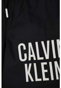 Calvin Klein Jeans szorty kąpielowe dziecięce kolor czarny. Kolor: czarny. Materiał: poliester, materiał. Wzór: nadruk #3