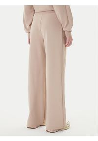 Guess Spodnie dresowe V5BB12 KCX22 Beżowy Regular Fit. Kolor: beżowy. Materiał: syntetyk #2