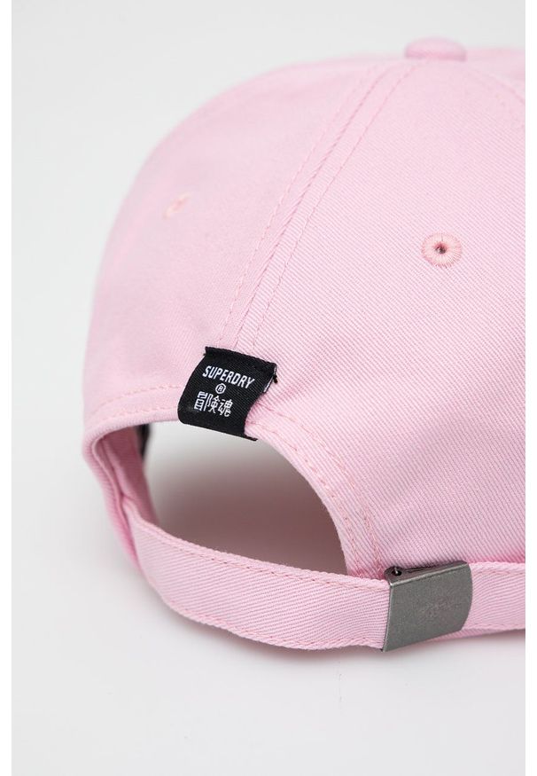 Superdry Czapka bawełniana kolor różowy z aplikacją. Kolor: różowy. Materiał: bawełna. Wzór: aplikacja