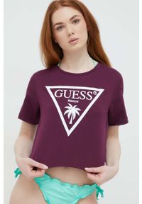 Guess t-shirt bawełniany kolor fioletowy. Kolor: fioletowy. Materiał: bawełna. Długość rękawa: krótki rękaw. Długość: krótkie. Wzór: nadruk #1