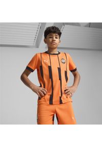 Puma - Młodzieżowa koszulka domowa FC Shakhtar Donetsk 24/25 PUMA Rickie Orange Black. Kolor: czarny, pomarańczowy, wielokolorowy, żółty. Sport: piłka nożna