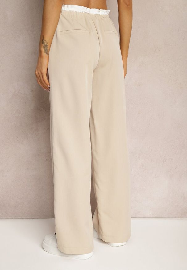 Renee - Jasnobeżowe Materiałowe Spodnie z Szerokimi Nogawkami High Waist z Gumką w Talii Comina. Okazja: na co dzień. Stan: podwyższony. Kolor: beżowy. Materiał: materiał. Styl: casual, elegancki
