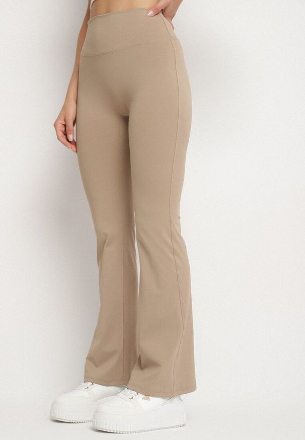 Born2be - Beżowe Legginsy Typu Dzwony z Wysokim Stanem Orralise. Stan: podwyższony. Kolor: beżowy. Materiał: tkanina. Styl: klasyczny