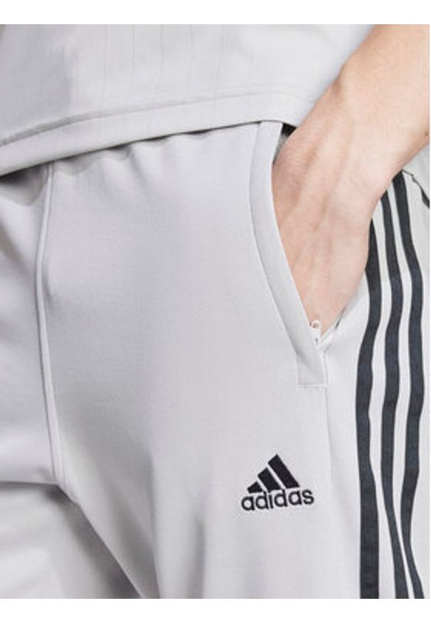 Adidas - adidas Spodnie dresowe Tiro IY4288 Szary Regular Fit. Kolor: szary. Materiał: bawełna, syntetyk