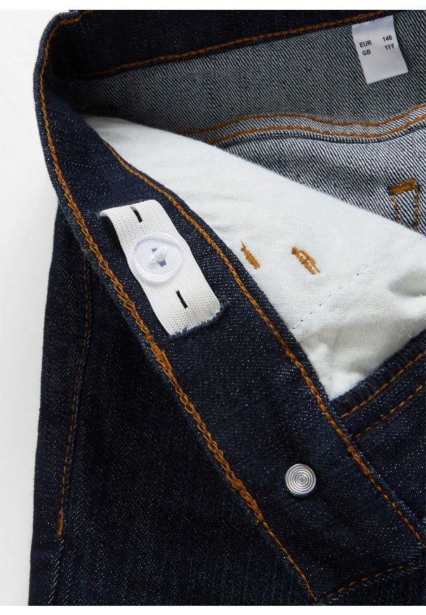 bonprix - Dżinsy flared, mid waist. Kolor: niebieski