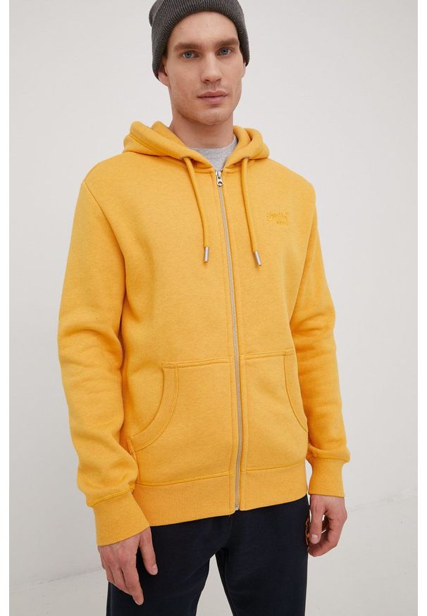 Superdry bluza męska kolor żółty z kapturem gładka. Typ kołnierza: kaptur. Kolor: żółty. Materiał: bawełna. Wzór: gładki
