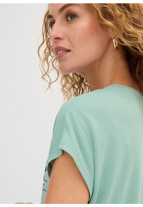 bonprix - T-shirt z brokatowym nadrukiem. Kolor: zielony. Wzór: nadruk