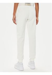 Guess Spodnie dresowe V4YB08 KCAY2 Écru Regular Fit. Materiał: syntetyk