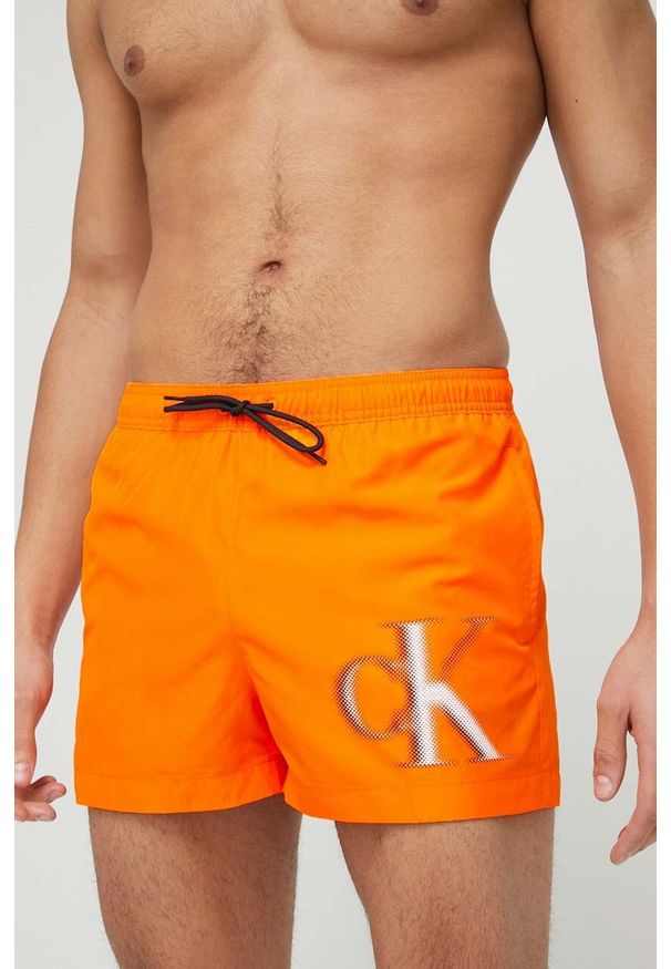 Calvin Klein szorty kąpielowe kolor pomarańczowy. Kolor: pomarańczowy. Materiał: tkanina, poliester, materiał. Wzór: nadruk