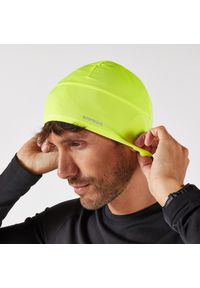 KIPRUN - Czapka do biegania Kiprun Warm+ ocieplana V2. Kolor: zielony, żółty, wielokolorowy. Materiał: materiał, poliester, elastan. Styl: sportowy #1