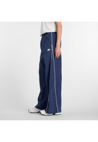 Spodnie damskie New Balance WB61Z1E6NNY – granatowe. Kolor: niebieski. Materiał: tkanina, nylon, materiał #5