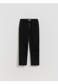 Reserved - Ocieplane spodnie - czarny. Kolor: czarny. Materiał: bawełna, tkanina