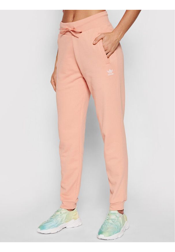 Adidas - adidas Spodnie dresowe adicolor Essentials H37874 Różowy Slim Fit. Kolor: różowy. Materiał: bawełna, dresówka