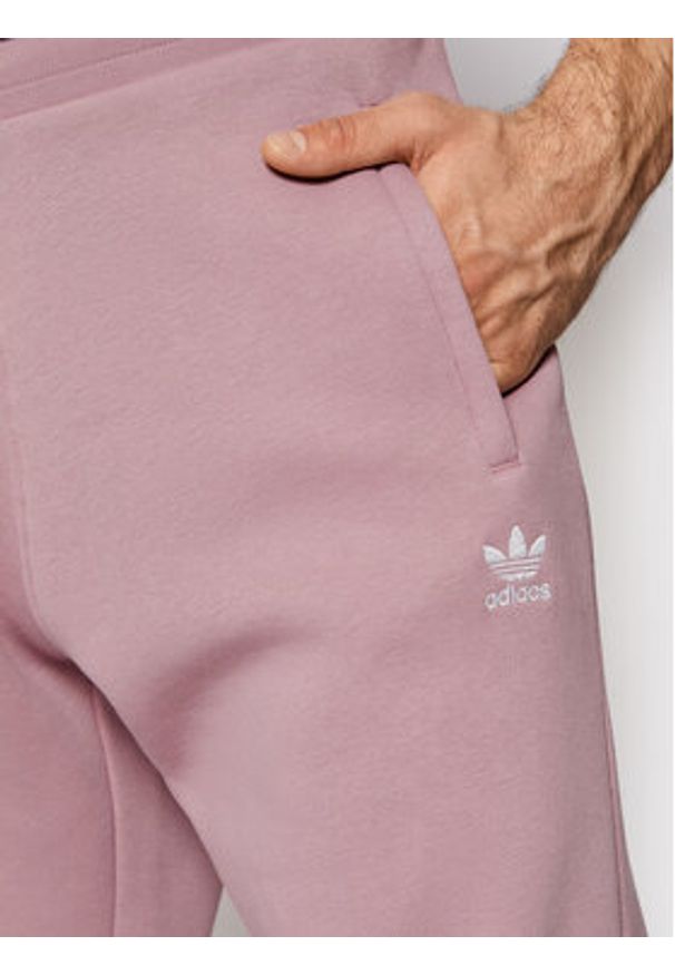 Adidas - adidas Spodnie dresowe adicolor Essentials HE9411 Fioletowy Slim Fit. Kolor: fioletowy. Materiał: dresówka, bawełna, syntetyk