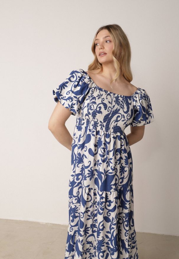 Born2be - Niebieska Rozkloszowana Sukienka z Wiskozy z Bufiastymi Rękawami w Roślinny Wzór Semea. Okazja: do pracy, na co dzień, na spotkanie biznesowe. Kolor: niebieski. Materiał: wiskoza. Sezon: lato. Typ sukienki: proste, rozkloszowane. Styl: biznesowy, casual. Długość: maxi