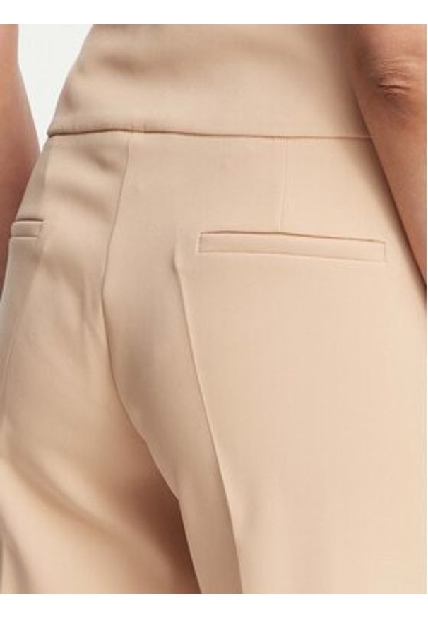 ACCESS FASHION Spodnie materiałowe 63-5022-135 Beżowy Flare Fit. Kolor: beżowy. Materiał: syntetyk